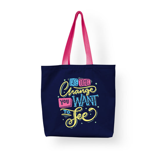 A cotton shopping tote by Sam and Zoey with the quote "Be the Change You Want to See," designed for eco-friendly shoppers and teachers.