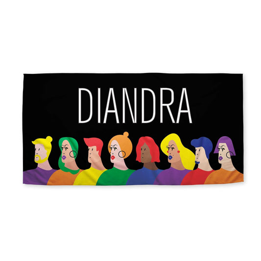 A faces of LGBTQ Pride beach towel with customized name 'Diandra' on a white surface