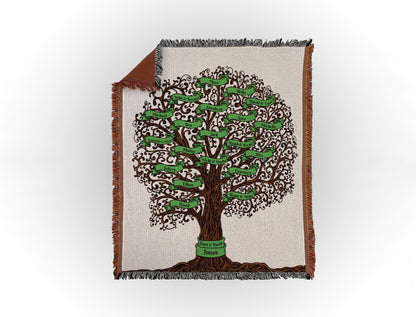 Woven throw blanket featuring an intricate family tree design with 20 names on green banners, displayed flat on a white background.