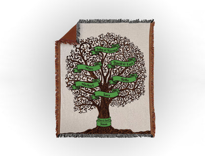 Woven throw blanket featuring an intricate family tree design with 6 names on green banners, displayed flat on a white background.