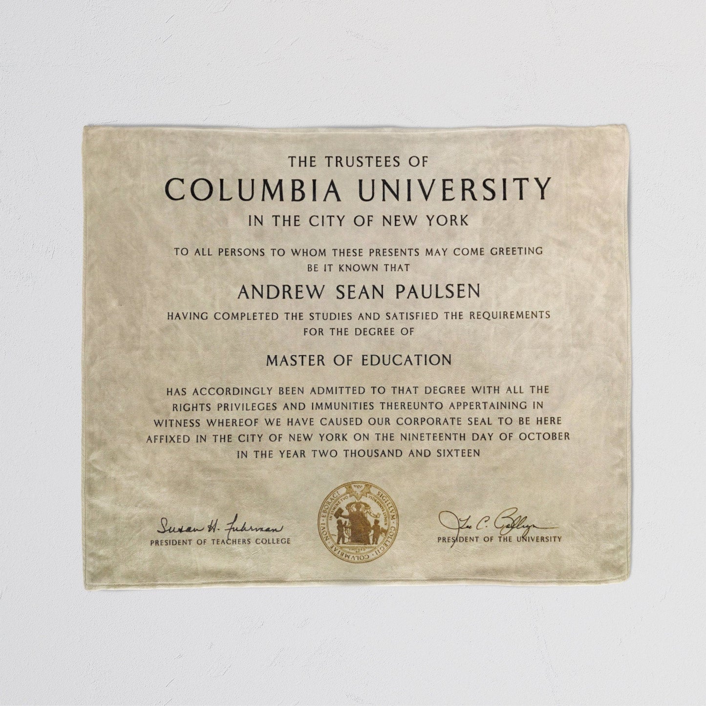 Cozy throw blanket with a printed diploma certificate design, detailed text in a white background