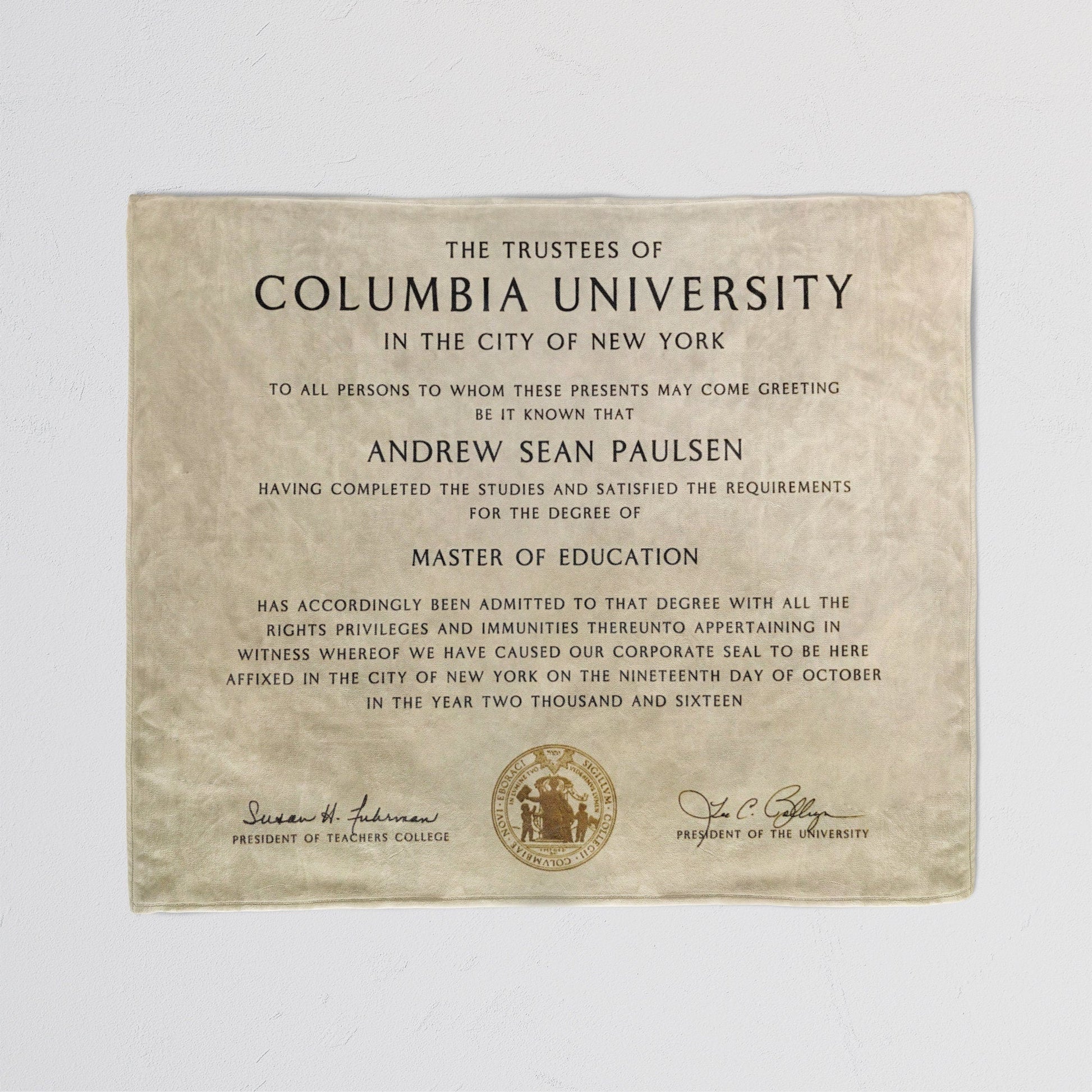 Cozy throw blanket with a printed diploma certificate design, detailed text in a white background