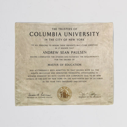 Cozy throw blanket with a printed diploma certificate design, detailed text in a white background