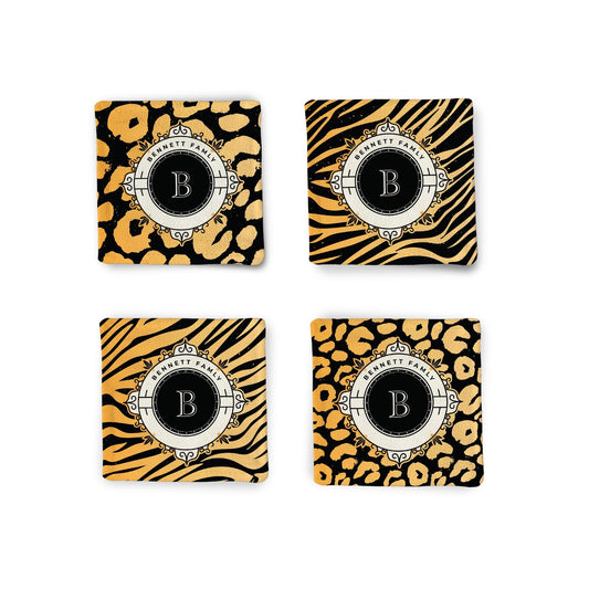 A set of 4 Personalized Animal Print Monogram Fabric Coasters on a white surface