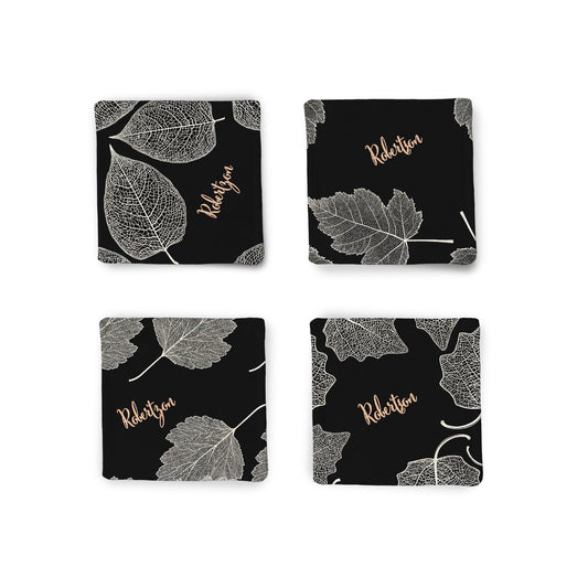 A set of 4 Personalized Autumn Leaves Fabric Coasters displayed on white surface