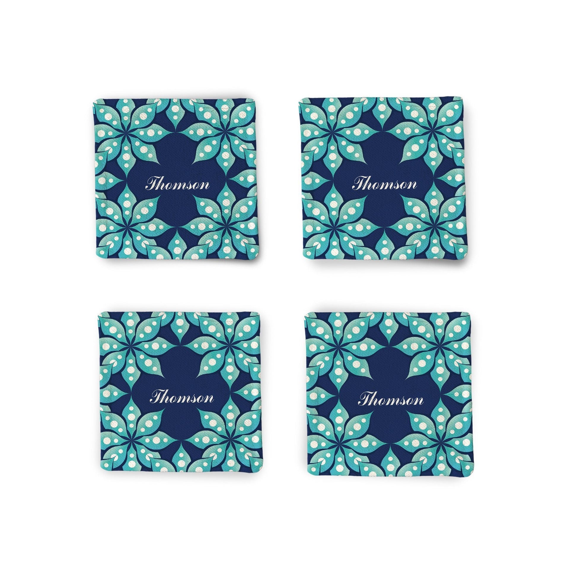 A set of 4 Personalized Fleur Fabric Coasters displayed on a white surface