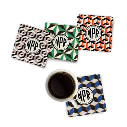 4 units of Geometric Fabric Coaster along with a coffee mug on white surface