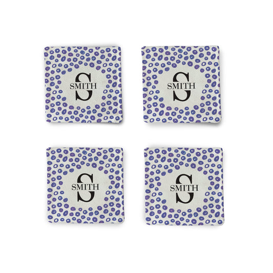 A set of 4 Purple Pebble Fabric Coasters on a white surface