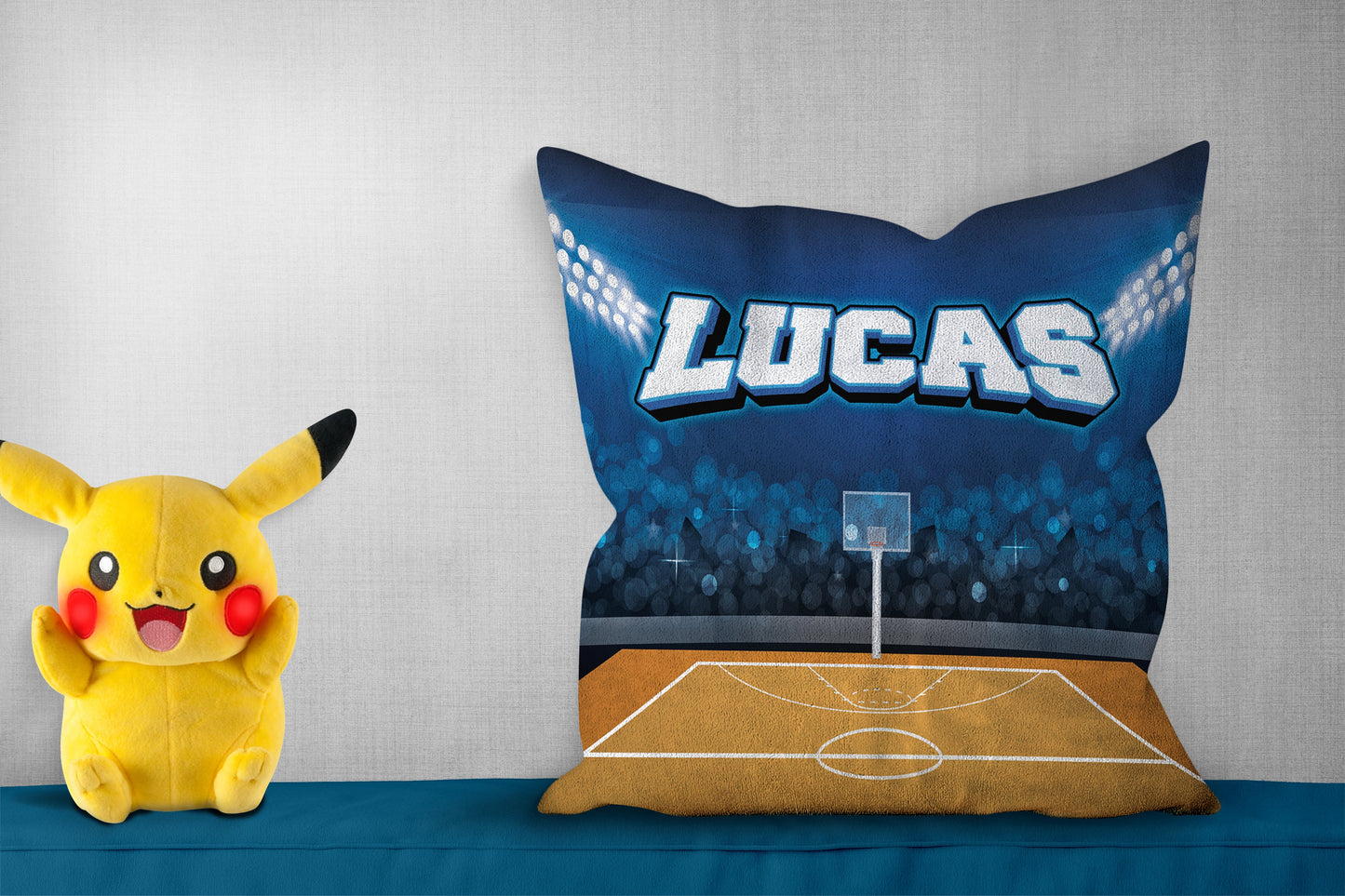 Personalized pillow with "Lucas," showing a soccer field design, pikachoo soft toy on side