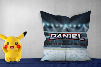 Personalized pillow with "Daniel," showing a hockey rink design, pikachoo soft toy on side