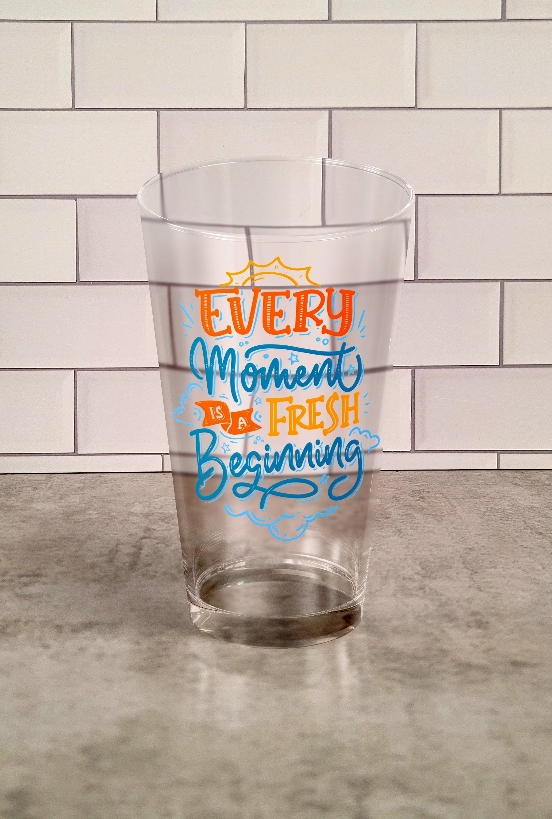 Every Moment Is A Fresh Beginning transparent Tumbler Glass against a slipslap wall