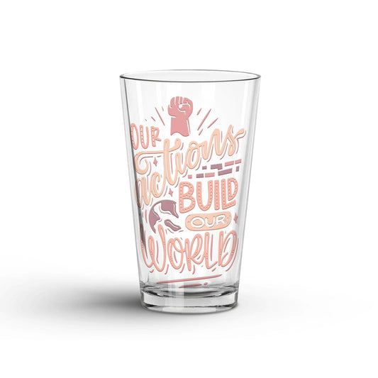 Our Actions Build Our World transparent Tumbler Glass being shown in a white background