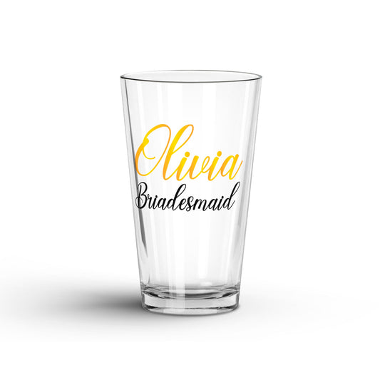 A tranparent Glass Tumbler with Personalized name and 'bridesmaid' printed on a white surface