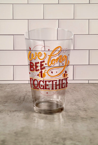 We Bee Long Together transparent Tumbler Glass against a slipslap wall