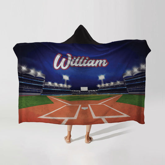 Person wearing a hooded fleece blanket with a baseball grandstand design, featuring the name "William" in bold letters