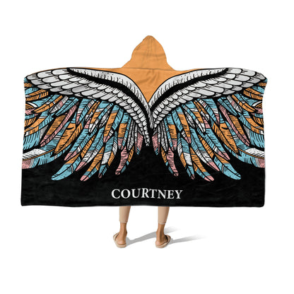 Person wearing a Hooded Fleece Blanket: Butterfly Wings design and a customized name Courtney