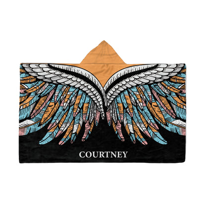 backside of a Hooded Fleece Blanket: Boho Wings design and a customized name Courtney