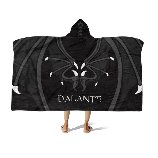 A person wearing a black & white hooded blanket with Dragon wings design and the name "Dalante" at the center-bottom on a white background.