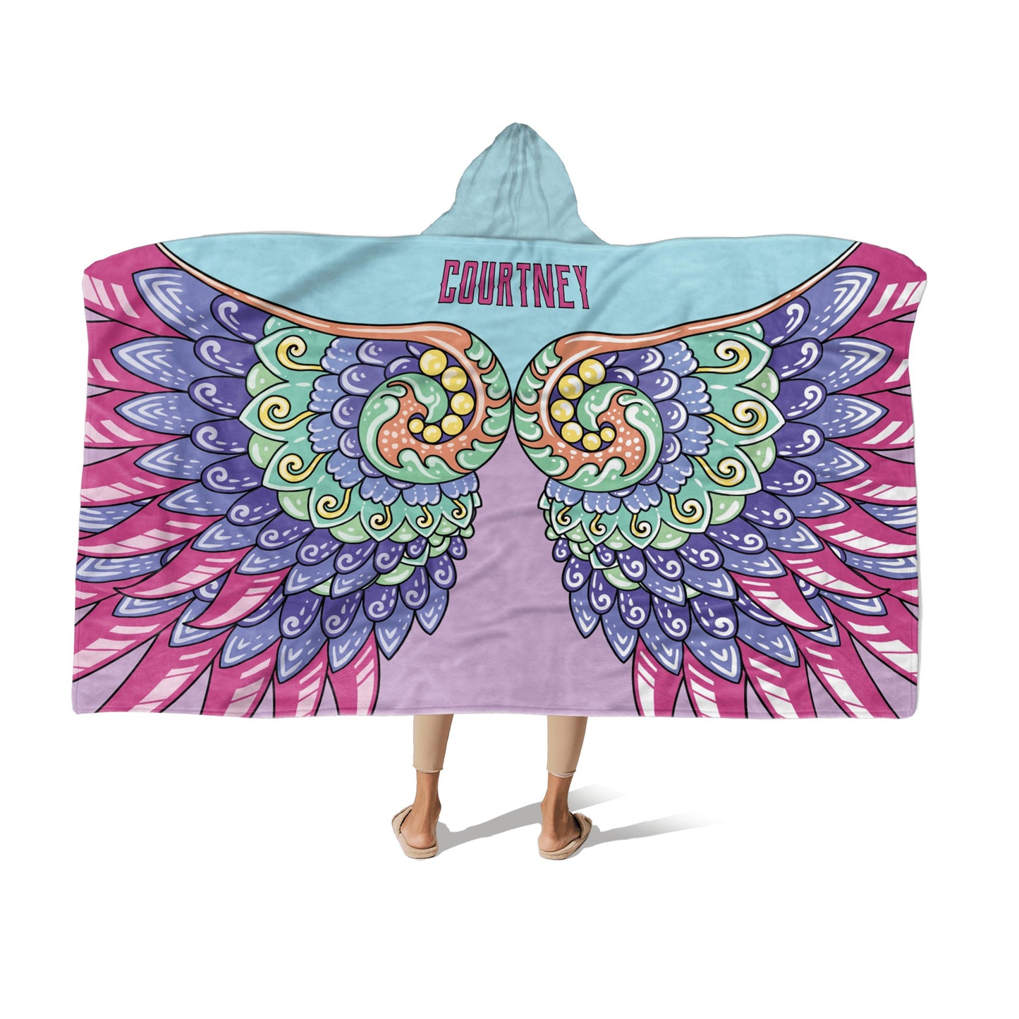 A person wearing a multi-color hooded blanket with Whimsical wings design and the name "Courtney" at the center-bottom on a white background.