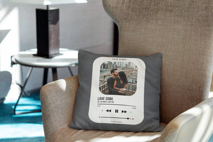 A grey customized photo pillow lying on couch