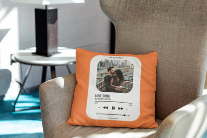 An orange customized photo pillow lying on couch