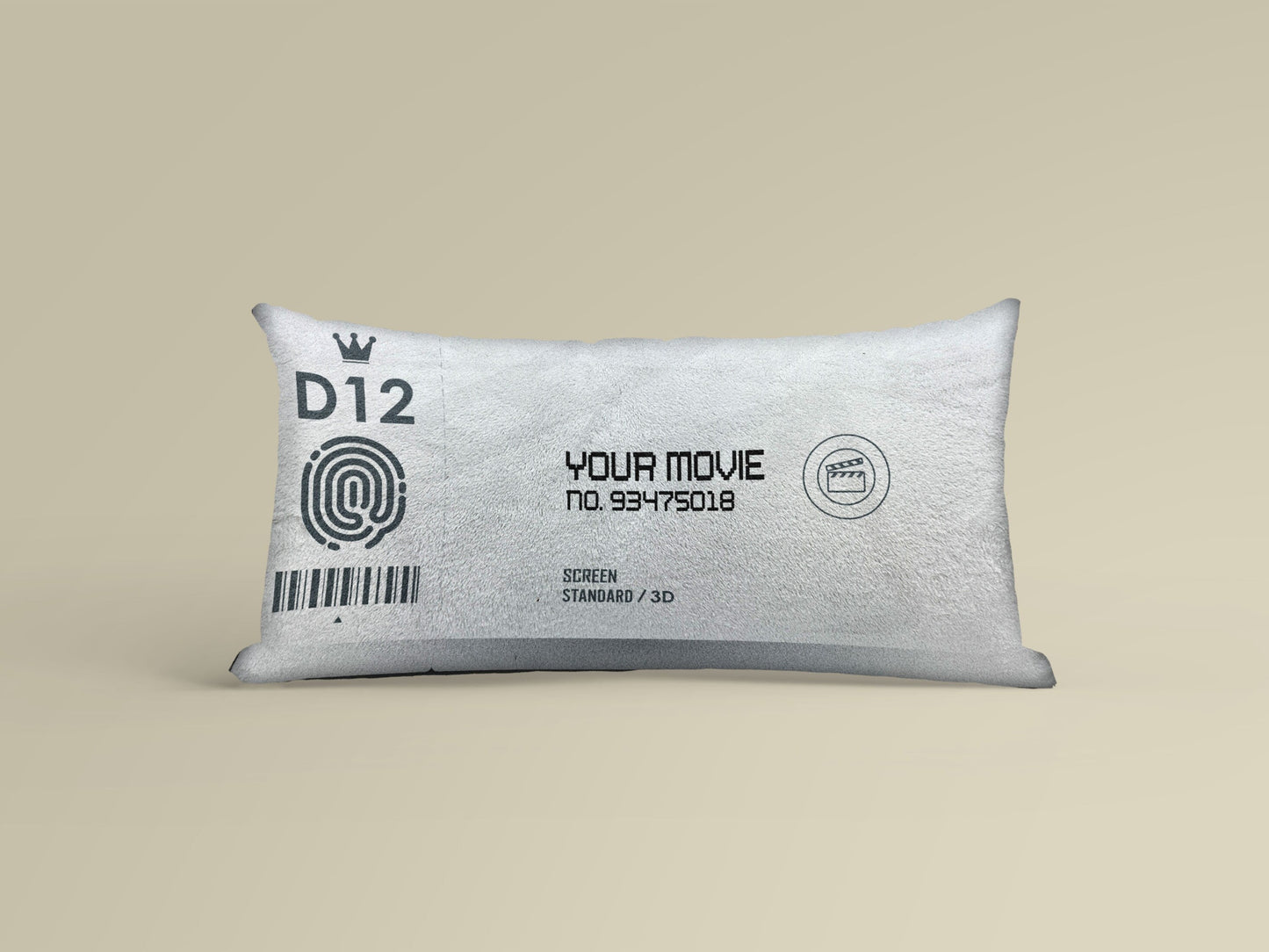 A personalized white movie ticket pillow on a yellowish background with thumb print, bar code and movie number