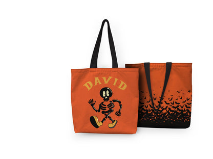 A black tote bag adorned with a stylish skeleton design, exuding a hip and playful vibe with a touch of Halloween whimsy.