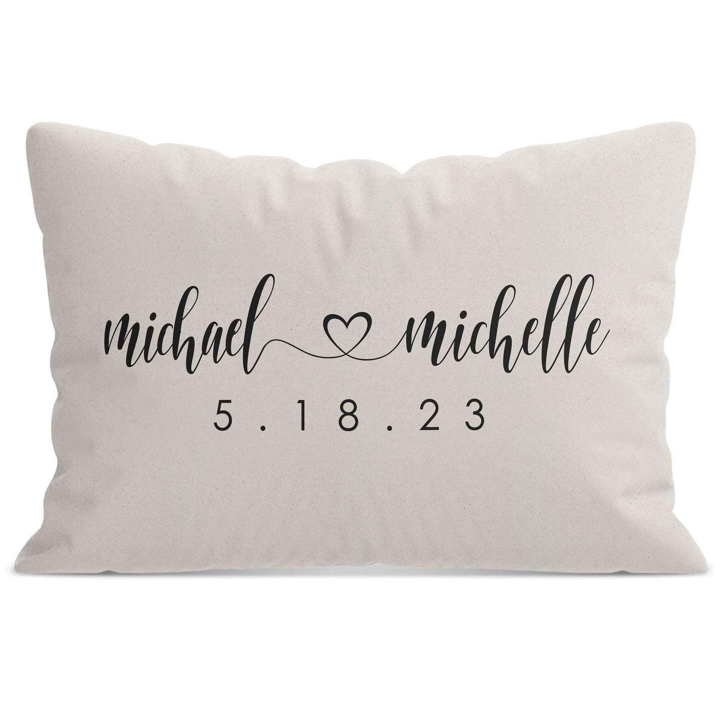 A white Personalized Wedding Monogram Throw Pillow with personalized names michael and michelle