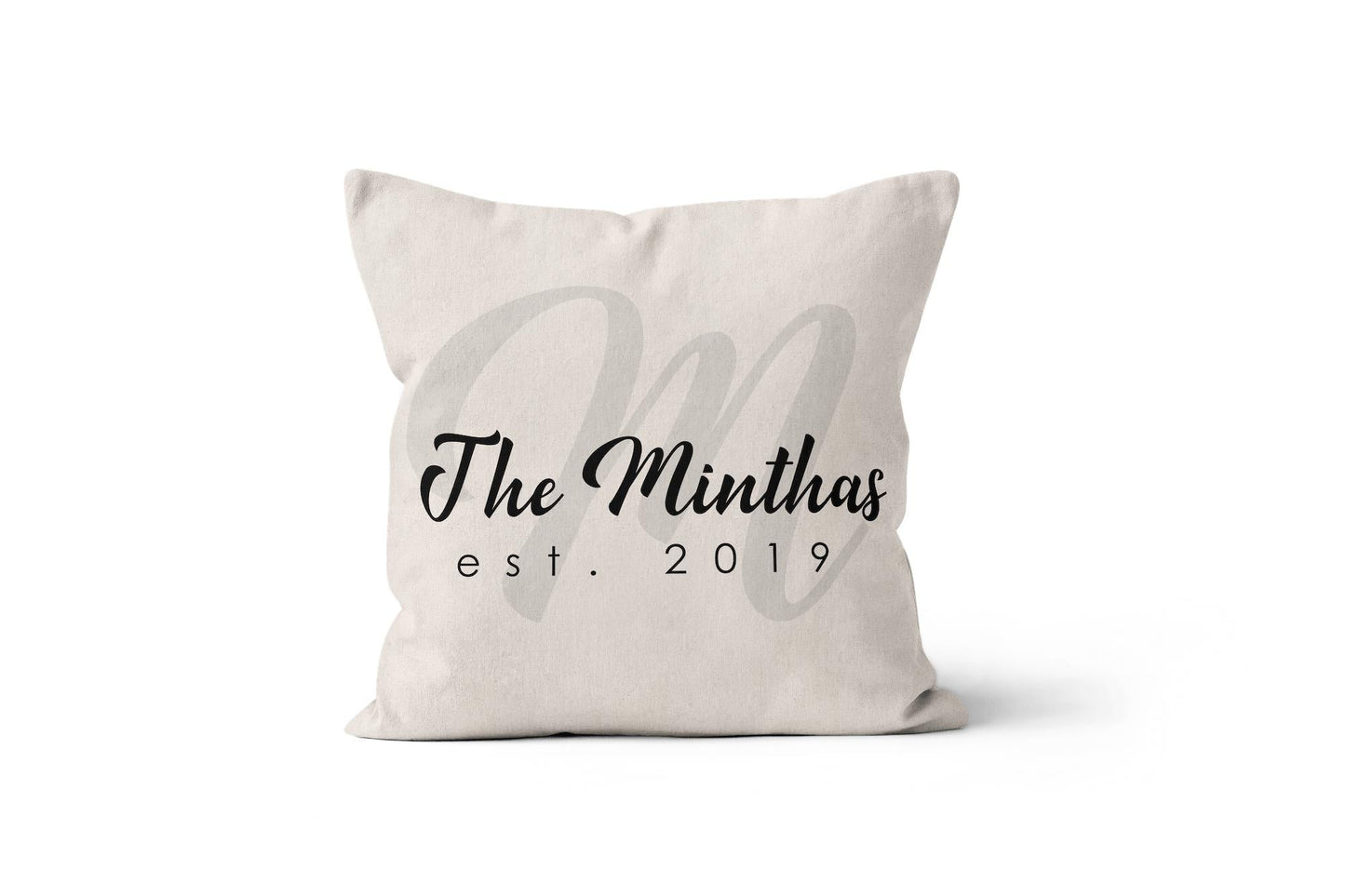 A white personalized wedding monogram throw pillow on a white background