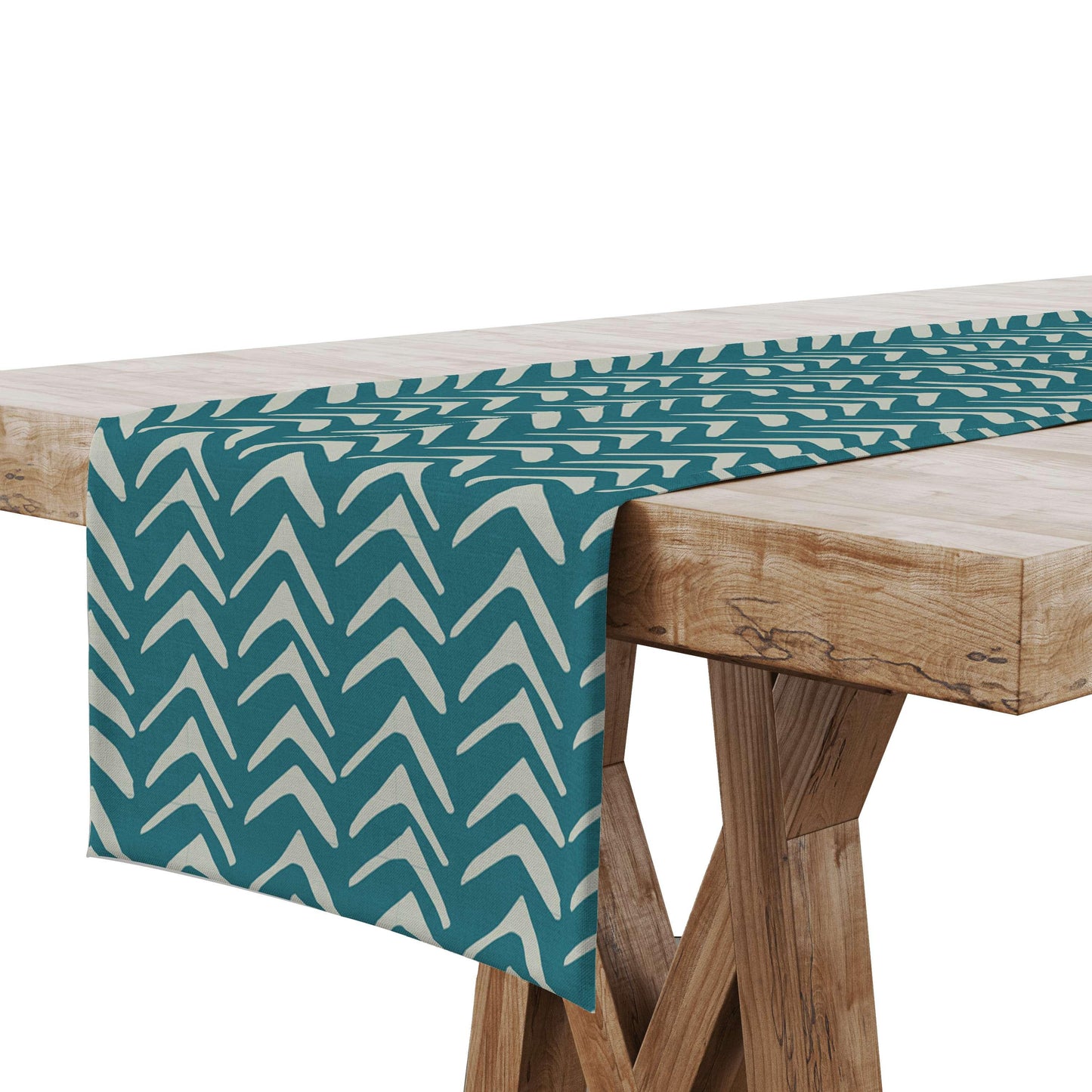 A Teal Tribal Table Runner displayed on a wooden table