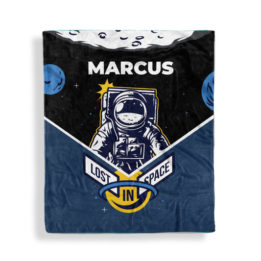 A throw blanket with lost in space design and customized name Marcus, displayed flat on white surface