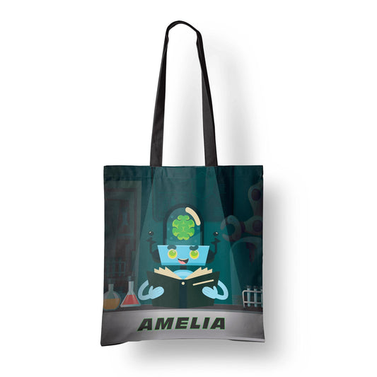 Tote bag with black handles featuring a cartoon alien scientist reading a book, personalized with the name "Amelia."