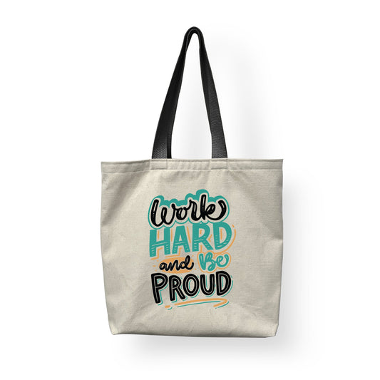 An elegant white fashion tote, with black handle and 'work hard and be proud' printed on it